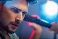 Portrait of a serious, handsome guitarist Royalty Free Stock Photo