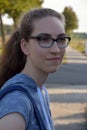 Serious looking teenage girl outside on a road Royalty Free Stock Photo