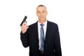 Portrait of serious mafia agent with handgun Royalty Free Stock Photo