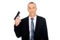 Portrait of serious mafia agent with handgun Royalty Free Stock Photo