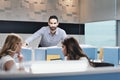 Portrait Of Worried Business Man Looking At Camera In Coworking Office