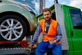 Portrait of serious male tow truck operator