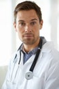 Portrait, serious man and doctor in clinic for healthcare management, hospital services and help. Face of male employee Royalty Free Stock Photo