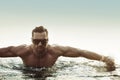 Portrait of a serious man in a tropical pool