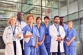 Portrait Of Serious Medical Team Standing In Modern Hospital Building