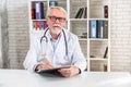 Headshot of senior male doctor, video call Royalty Free Stock Photo