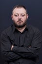 Portrait of serious man with black shirt