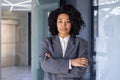 Portrait of serious successful African American business woman, boss in business suit looking focused at camera with