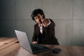 Portrait of serious successful businessman in suit looking at camera and pointing finger forward calling to action Royalty Free Stock Photo