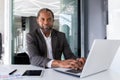 Portrait of serious thinking and confident businessman, african american boss thinking and looking at camera, man Royalty Free Stock Photo