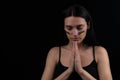 Portrait of serious ukrainian woman with blue and yellow ukrainian flag on her cheek.The symbol of the inviolability of the