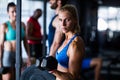 Portrait of serious woman holding dumbbell in gym Royalty Free Stock Photo