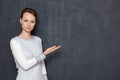 Portrait of serious woman pointing at copy space on right Royalty Free Stock Photo