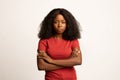 Portrait of serious young african american woman standing with folded arms Royalty Free Stock Photo