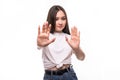 Portrait of serious young asian woman standing with outstretched hand showing stop gesture isolated over white background Royalty Free Stock Photo