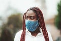 Black girl in virus-protective mask