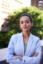 A portrait of a serious young business woman standing on the office balcony Royalty Free Stock Photo