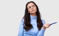 Portrait of serious young businesswoman wearing blue long sleeve blouse and round transparent eyeglasses. European female office Royalty Free Stock Photo