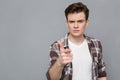 Portrait of a serious young man pointing on you Royalty Free Stock Photo