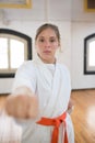 Portrait of serious young woman in combative position