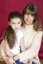 Portrait of seven year old daughter and young mother