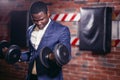 Healthy african man working out with dumbbells in gym Royalty Free Stock Photo