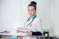 A portrait of beautiful midicine nurse doctor in a white gown Royalty Free Stock Photo