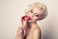 Portrait of blond woman with macaron Royalty Free Stock Photo