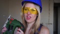 Portrait of a sexy blonde woman builder. Beautiful arousing woman builder