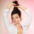 Portrait of brunette girl long hair on pink Royalty Free Stock Photo