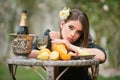 Portrait of sexy girl on summer picnic on a grass in the park with wine and fresh fruits. Outdoor fashion photo of Royalty Free Stock Photo