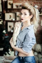 Portrait of housewife prepares dish in kitchen room. Young happy woman cooking at domestic kitchen. girl knead the dough Royalty Free Stock Photo