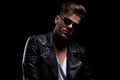 Portrait of man wearing black leather jacket and sunglasses Royalty Free Stock Photo