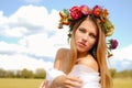 Portrait of pretty girl in flower wreath with Royalty Free Stock Photo