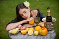 Portrait of sexy woman relaxing and eating fruit outdoor. Exotic summer diet, tropical fruits. Beauty woman face. Royalty Free Stock Photo