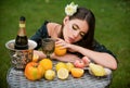 Portrait of sexy woman relaxing and eating fruit outdoor. Exotic summer diet, tropical fruits. Beauty woman face. Royalty Free Stock Photo