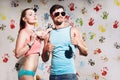 Portrait of young couple with thumbs up sign on a funny pos Royalty Free Stock Photo