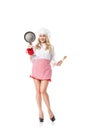 Portrait of young woman with frying pan and spoon in high heels Royalty Free Stock Photo