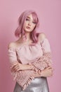 Portrait of a sexy young woman with pink hair. Perfect hairstyle and hair coloring. Girl with beautiful blue eyes and long pink Royalty Free Stock Photo