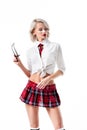 portrait of sexy young woman in short schoolgirl plaid skirt with eyeglasses posing