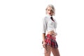 portrait of sexy young woman in short schoolgirl plaid skirt with eyeglasses posing