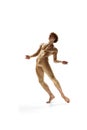 Portrait of shirtless artistic ballet dancer, dancing and demonstrating his athletic body against white studio