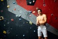 Portrait of cheerful rock climber in indoor climbing gym Royalty Free Stock Photo