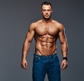 Portrait of shirtless muscular male in a jeans. Royalty Free Stock Photo