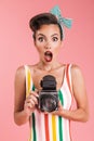 Portrait of a shocked brunette pin-up girl in plaid shirt Royalty Free Stock Photo