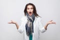 Portrait of shocked brunette woman in white striped jacket and b Royalty Free Stock Photo