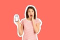 Portrait of a shocked girl with an open mouth showing a blank mobile phone screen. emotional girl Magazine collage style with