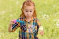 portrait of shocked kid blowing soap bubbles Royalty Free Stock Photo