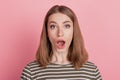 Portrait of shocked lady open mouth wow reaction look camera on pink background