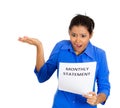 Portrait of shocked looking young woman looking at her monthly statement isolated on white background Royalty Free Stock Photo